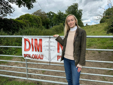 Tara-Jane Sutcliffe opposing pylons in the Tywi Valley